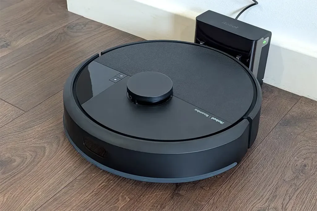 iRobot Roomba Essential showing the LiDAR navigation turret and top control buttons.