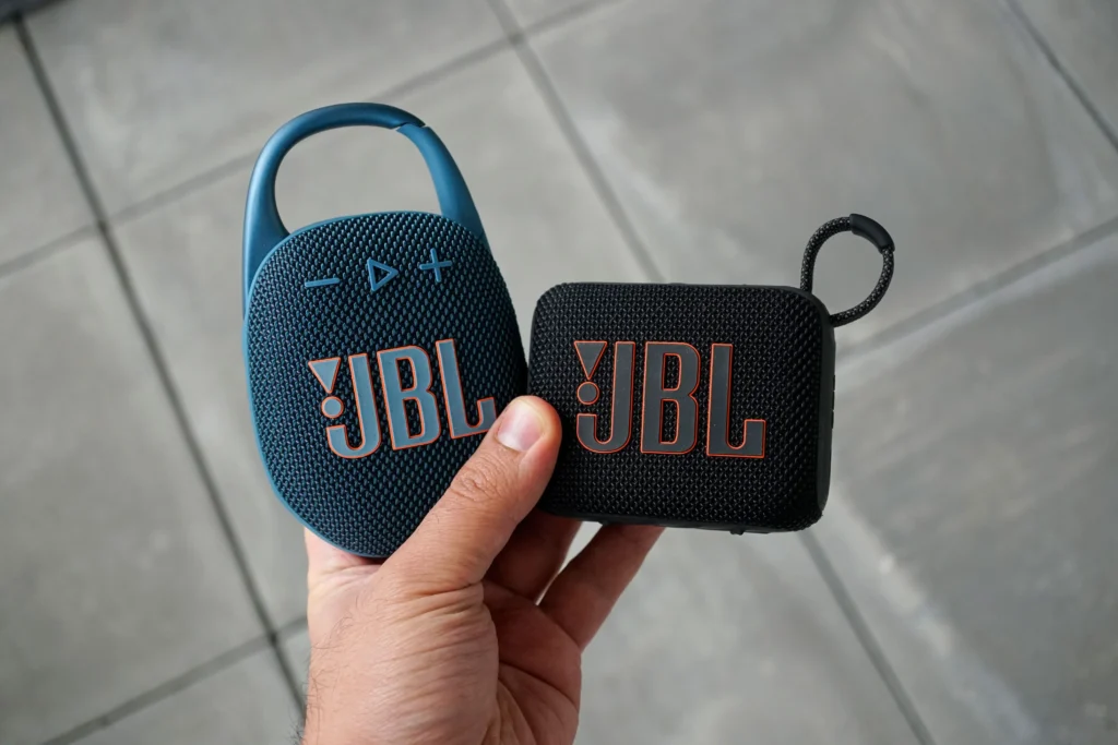 Close-up of JBL Clip 4 and Go 3 waterproof Bluetooth speakers side-by-side. JBL Go 4 vs Clip 5 Price Difference