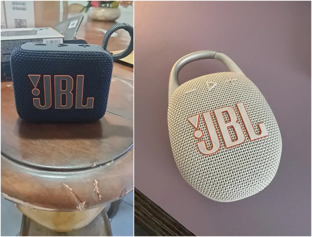 Navy blue JBL Go 4 and sand-colored JBL Clip 5 speakers side-by-side.