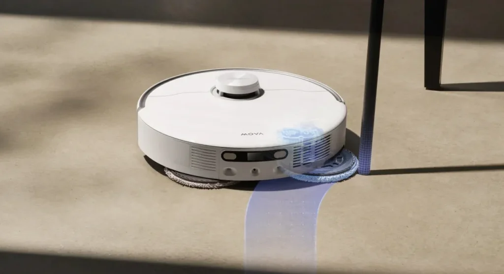 White MOVA P50 Pro Ultra robot vacuum extending its mop pad to clean around a chair leg.