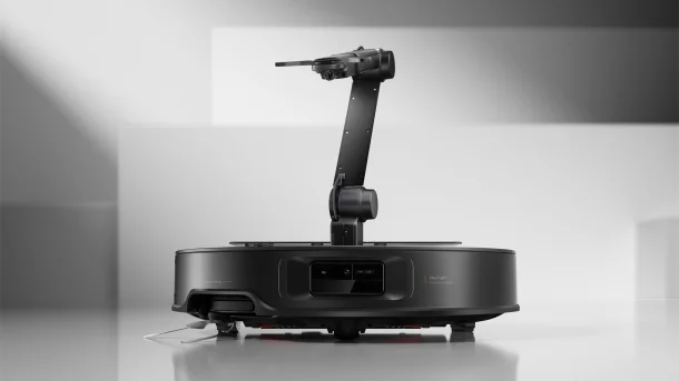 Roborock Saros Z70 robot vacuum with extended five-axis OmniGrip mechanical arm.