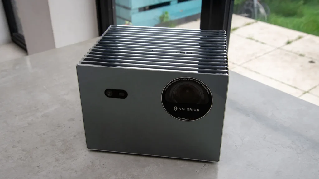 Silver Valerion VisionMaster Pro 2 projector with a mirrored front and black lens.
