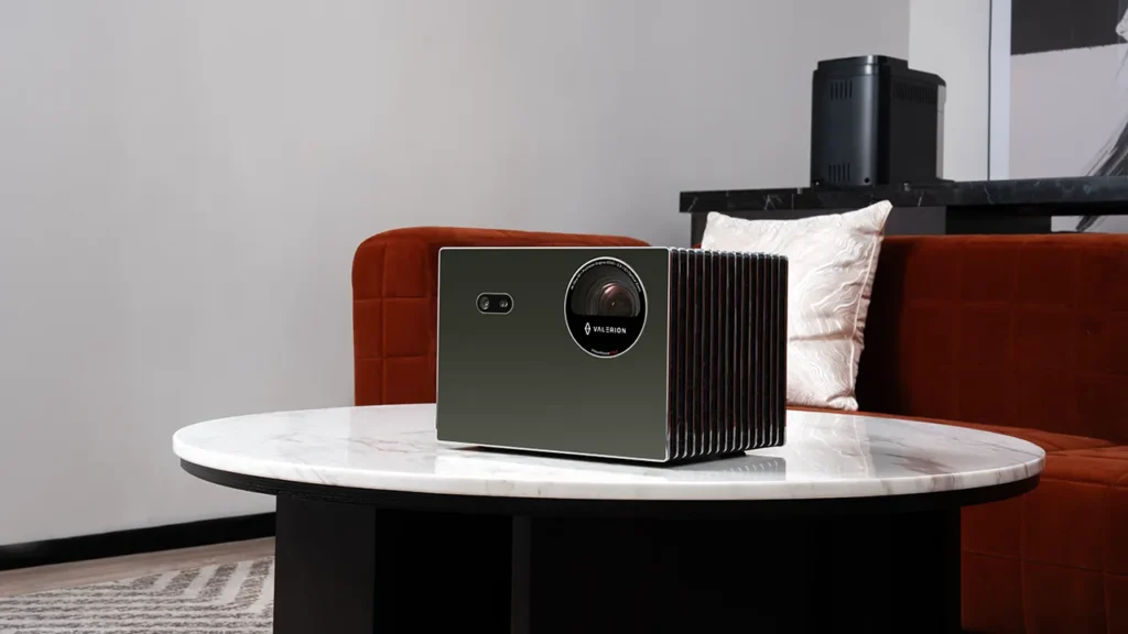 Valerion VisionMaster Pro 2 projector with a mirrored front on a marble table.