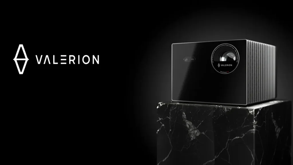 lack Valerion smart projector with vertical cooling fins on a marble stand. Valerion Projector Review